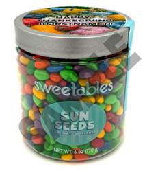 A jar of candy with a label

Description automatically generated