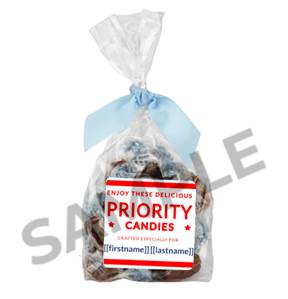 A bag of candy with a blue bow

Description automatically generated